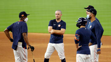 Third Base Coach Gary Pettis of the Houston Astros, left, gives instructions to Alex Bregman, Carlos Correa, Yuli Gurriel and Jose Altuve. (Photo by Bob Levey/Getty Images)