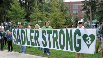 Sep 24, 2016; East Lansing, MI, USA; Fans display a Sadler Strong banner honoring Mike Sadler former punter for Michigan State Spartans who was killed in a car accident over the summer prior to a game against the Wisconsin Badgers at Spartan Stadium. Mandatory Credit: Mike Carter-USA TODAY Sports