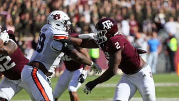 Auburn footballCOLLEGE STATION, TEXAS - NOVEMBER 06: Micheal Clemons #2 of the Texas A&M Aggies and Brodarious Hamm #59 of the Auburn Tigers lock up at Kyle Field on November 06, 2021 in College Station, Texas. (Photo by Bob Levey/Getty Images)