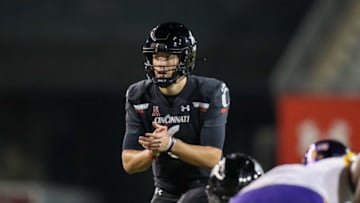Cincinnati Bearcats quarterback Ben Bryant snaps the ball against the East Carolina Pirates at Nippert Stadium. USA Today.