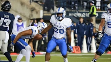 Sep 24, 2016; Logan, UT, USA; Air Force Falcons running back Malik Miller (26) celebrates after scoring a touchdown during the fourth quarter against the Utah State Aggies at Merlin Olsen Field at Maverik Stadium. Air Force won 27-20. Mandatory Credit: Chris Nicoll-USA TODAY Sports