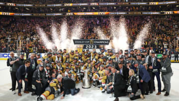 LAS VEGAS, NEVADA - JUNE 13: Members of the Vegas Golden Knights pose with the Stanley Cup after defeating the Florida Panthers to win the championship in Game Five of the 2023 NHL Stanley Cup Final at T-Mobile Arena on June 13, 2023 in Las Vegas, Nevada. (Photo by Christian Petersen/Getty Images)