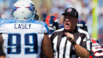 NASHVILLE, TN - SEPTEMBER 25: Umpire Dan Ferrell has a talk with Jurrell Casey #99 of the Tennessee Titans during a game against the Denver Broncos at LP Field on September 25, 2011 in Nashville, Tennessee. The Titans defeated the Broncos 17 - 14. (Photo by Wesley Hitt/Getty Images)
