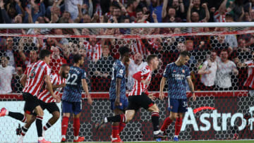 BRENTFORD, ENGLAND - AUGUST 13: Sergi Canos of Brentford celebrates after scoring their team's first goal during the Premier League match between Brentford and Arsenal at Brentford Community Stadium on August 13, 2021 in Brentford, England. (Photo by Eddie Keogh/Getty Images)