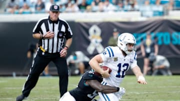 JACKSONVILLE, FL - DECEMBER 02: Andrew Luck #12 of the Indianapolis Colts is sacked by Yannick Ngakoue #91 of the Jacksonville Jaguars during a game at TIAA Bank Field on December 2, 2018 in Jacksonville, Florida. (Photo by Joe Robbins/Getty Images)