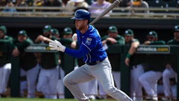 MESA, ARIZONA - FEBRUARY 24: Brett Phillips #14 of the Kansas City Royals hits an RBI single in the first inning against the Oakland Athletics at HoHoKam Stadium on February 24, 2019 in Mesa, Arizona. (Photo by Jennifer Stewart/Getty Images)