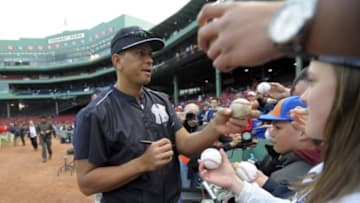 May 1, 2015; Boston, MA, USA; New York Yankees designated hitter Alex Rodriguez (13) signs an autograph for a fan prior to a game against the Boston Red Sox at Fenway Park. Mandatory Credit: Bob DeChiara-USA TODAY Sports