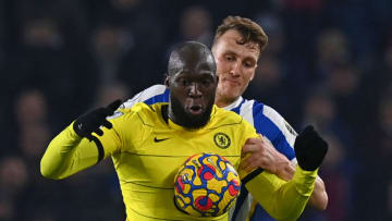 Chelsea's Belgian striker Romelu Lukaku (L) vies with Brighton's English defender Dan Burn (R) during the English Premier League football match between Brighton and Hove Albion and Chelsea at the American Express Community Stadium in Brighton, southern England on January 18, 2022. - RESTRICTED TO EDITORIAL USE. No use with unauthorized audio, video, data, fixture lists, club/league logos or 'live' services. Online in-match use limited to 120 images. An additional 40 images may be used in extra time. No video emulation. Social media in-match use limited to 120 images. An additional 40 images may be used in extra time. No use in betting publications, games or single club/league/player publications. (Photo by Glyn KIRK / AFP) / RESTRICTED TO EDITORIAL USE. No use with unauthorized audio, video, data, fixture lists, club/league logos or 'live' services. Online in-match use limited to 120 images. An additional 40 images may be used in extra time. No video emulation. Social media in-match use limited to 120 images. An additional 40 images may be used in extra time. No use in betting publications, games or single club/league/player publications. / RESTRICTED TO EDITORIAL USE. No use with unauthorized audio, video, data, fixture lists, club/league logos or 'live' services. Online in-match use limited to 120 images. An additional 40 images may be used in extra time. No video emulation. Social media in-match use limited to 120 images. An additional 40 images may be used in extra time. No use in betting publications, games or single club/league/player publications. (Photo by GLYN KIRK/AFP via Getty Images)