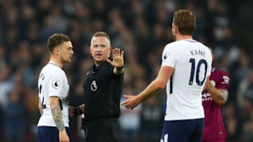 LONDON, ENGLAND - APRIL 14: Kieran Trippier of Tottenham Hotspur and Harry Kane of Tottenham Hotspur argue with Jonathan Moss during the Premier League match between Tottenham Hotspur and Manchester City at Wembley Stadium on April 14, 2018 in London, England. (Photo by Catherine Ivill/Getty Images)