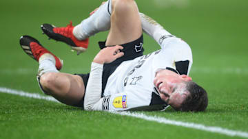 DERBY, ENGLAND - DECEMBER 01: Harry Wilson of Derby County goes down injured during the Sky Bet Championship between Derby County and Swansea City at Pride Park Stadium on December 01, 2018 in Derby, England. (Photo by Nathan Stirk/Getty Images)