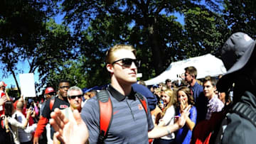 Oct 4, 2014; Oxford, MS, USA; Mississippi Rebels quarterback Bo Wallace (14) walks through the crowd gathered before the game against Alabama Crimson Tide at Vaught-Hemingway Stadium. Mandatory Credit: Christopher Hanewinckel-USA TODAY Sports