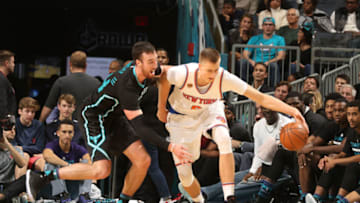 CHARLOTTE, NC - NOVEMBER 26: Kristaps Porzingis #6 of the New York Knicks drives against Frank Kaminsky III #44 of the Charlotte Hornets during the game at the Spectrum Center on November 26, 2016 in Charlotte, North Carolina. Copyright 2016 NBAE (Photo by Brock Williams-Smith/NBAE via Getty Images)