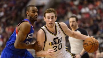 Mar 8, 2014; Philadelphia, PA, USA; Utah Jazz guard Gordon Hayward (20) is defended by Philadelphia 76ers guard Elliot Williams (25) during the third quarter at Wells Fargo Center. The Jazz defeated the Sixers 104-92. Mandatory Credit: Howard Smith-USA TODAY Sports