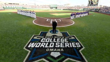 OMAHA, NE - JUNE 27: Players line up for the national anthem as Louisiana State University takes on the University of Florida during the Division I Men's Baseball Championship held at TD Ameritrade Park on June 27, 2017 in Omaha, Nebraska. (Photo by Jamie Schwaberow/NCAA Photos via Getty Images)