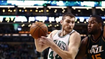 Feb 29, 2016; Boston, MA, USA; Boston Celtics center Tyler Zeller (44) drives to the basket against Utah Jazz forward Derrick Favors (15) during the first half at TD Garden. Mandatory Credit: Mark L. Baer-USA TODAY Sports
