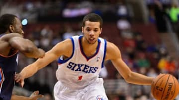 Apr 2, 2014; Philadelphia, PA, USA; Philadelphia 76ers guard Michael Carter-Williams (1) is defended by Charlotte Bobcats guard Kemba Walker (15) during the first quarter at the Wells Fargo Center. Mandatory Credit: Howard Smith-USA TODAY Sports