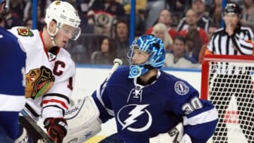 Feb 27, 2015; Tampa, FL, USA; Tampa Bay Lightning goalie Ben Bishop (30) looks at Chicago Blackhawks center Jonathan Toews (19) after making a save during the third period at Amalie Arena. Tampa Bay Lightning defeated the Chicago Blackhawks 4-0. Mandatory Credit: Kim Klement-USA TODAY Sports