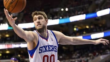 Feb 7, 2014; Philadelphia, PA, USA; Philadelphia 76ers center Spencer Hawes (00) grabs a rebound during the second quarter against the Los Angeles Lakers at the Wells Fargo Center. The Lakers defeated the Sixers 112-98. Mandatory Credit: Howard Smith-USA TODAY Sports