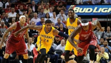 Dec 18, 2013; Miami, FL, USA; Miami Heat small forward LeBron James (6) and Indiana Pacers small forward Paul George (24) both chase a loose ball during the first half at American Airlines Arena. Mandatory Credit: Steve Mitchell-USA TODAY Sports