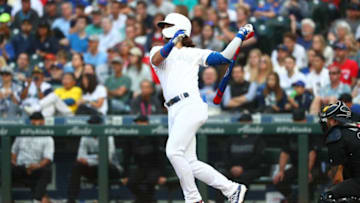 Bo Bichette #11 of the Toronto Blue Jays hits a solo home run against the Seattle Mariners in the third inning during their game at T-Mobile Park on August 24, 2019 in Seattle, Washington. Teams are wearing special color schemed uniforms with players choosing nicknames to display for Players' Weekend. (Photo by Abbie Parr/Getty Images)