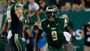 TAMPA, FL - SEPTEMBER 21: Quarterback Quinton Flowers #9 of the South Florida Bulls celebrates with tight end Mitchell Wilcox #89 after rushing 22 yards for a touchdown during the second quarter of an NCAA football game against the Temple Owls on September 21, 2017 at Raymond James Stadium in Tampa, Florida. (Photo by Brian Blanco/Getty Images)