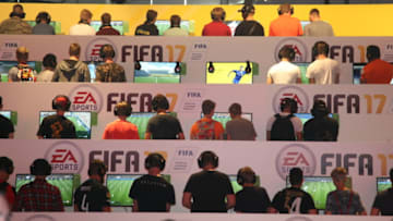 COLOGNE, GERMANY - 2016/08/18: Visitors playing Fifa 17 at the EA Sports stand at the Gamescom fair. Gamescom the Worlds largest Gaming Fair.Gamescom is a trade fair for video games held annually at the Koelnmesse in Cologne. It is organised by the BIU. (Photo by Maik Boenisch/Pacific Press/LightRocket via Getty Images)