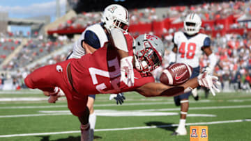 TUCSON, ARIZONA - NOVEMBER 19: Running back Nakia Watson #25 of the Washington State Cougars loses control of the football as he dives toward the end-zone during the second half of the NCAAF game against the Arizona Wildcats at Arizona Stadium on November 19, 2022 in Tucson, Arizona. The Cougars defeated the Wildcats 31-20. (Photo by Christian Petersen/Getty Images)