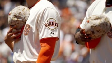 May 26, 2014; San Francisco, CA, USA; San Francisco Giants outfielder Hunter Pence (8) holds onto his hat during the playing of the national anthem before the start of the game against the Chicago Cubs at AT&T Park. Mandatory Credit: Cary Edmondson-USA TODAY Sports
