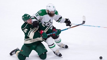 Oct 29, 2016; Saint Paul, MN, USA; Dallas Stars forward Patrick Eaves (18) checks Minnesota Wild forward Mikael Granlund (64) in the third period at Xcel Energy Center. The Minnesota Wild beat the Dallas Stars 4-0. Mandatory Credit: Brad Rempel-USA TODAY Sports