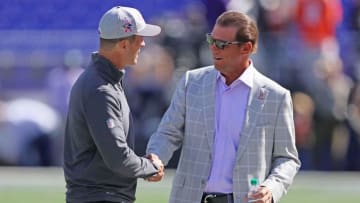 Oct 11, 2015; Baltimore, MD, USA; Baltimore Ravens head coach John Harbaugh (left) and team owner Steve Biscotti (right) meet prior to the game against the Cleveland Browns at M&T Bank Stadium. Mandatory Credit: Mitch Stringer-USA TODAY Sports