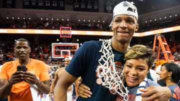 Auburn basketball forward Jabari Smith (10) greets his parents, Jabari Smith Sr. and Taneskia Purnell as Auburn Tigers men's basketball celebrates the regular season SEC championship at Neville Arena in Auburn, Ala., on Saturday, March 5, 2022. Auburn Tigers defeated South Carolina Gamecocks 82-71.
