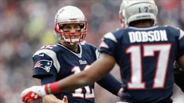 Oct 27, 2013; Foxborough, MA, USA; New England Patriots quarterback Tom Brady (12) talks with New England Patriots wide receiver Aaron Dobson (17) during the third quarter against the Miami Dolphins at Gillette Stadium. Mandatory Credit: Winslow Townson-USA TODAY Sports