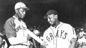 KANSAS CITY - 1942. Satchel Paige of the Monarchs talks with Josh Gibson of the Homestead Grays before a game in Kansas City in 1941. (Photo by Mark Rucker/Transcendental Graphics, Getty Images)