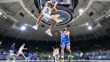 Dec 11, 2021; South Bend, Indiana, USA; Notre Dame Fighting Irish guard Dane Goodwin (23) dunks in front of Kentucky Wildcats guard Davion Mintz (10) as time expires in the second half at the Purcell Pavilion. Mandatory Credit: Matt Cashore-USA TODAY Sports