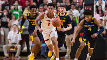 LUBBOCK, TEXAS - JANUARY 29: Guard Terrence Shannon Jr. #1 of the Texas Tech Red Raiders handles the ball against forward Gabe Osabuohien #3 and forward Miles McBride #4 of the West Virginia Mountaineers during the second half of the college basketball game on January 29, 2020 at United Supermarkets Arena in Lubbock, Texas. (Photo by John E. Moore III/Getty Images)