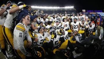 NEW YORK, NY - DECEMBER 27: The Iowa Hawkeyes celebrate after defeating the Boston College Eagles in the New Era Pinstripe Bowl at Yankee Stadium on December 27, 2017 in the Bronx borough of New York City. The Iowa Hawkeyes won 27-20. (Photo by Adam Hunger/Getty Images)