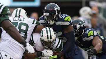 Oct 2, 2016; East Rutherford, NJ, USA; Seattle Seahawks defensive end Frank Clark (55) tackles New York Jets running back Matt Forte (22) in the first half at MetLife Stadium. Mandatory Credit: William Hauser-USA TODAY Sports