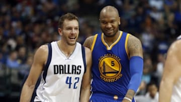 Mar 18, 2016; Dallas, TX, USA; Dallas Mavericks forward David Lee (42) walks with Golden State Warriors center Marreese Speights (5) during the game at American Airlines Center. Golden State won 130-112. Mandatory Credit: Tim Heitman-USA TODAY Sports
