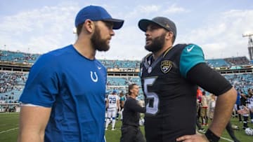 Dec 13, 2015; Jacksonville, FL, USA; Indianapolis Colts quarterback Andrew Luck (left) talks with Jacksonville Jaguars quarterback Blake Bortles (5) after a game at at EverBank Field. The Jacksonville Jaguars won 51-16. Mandatory Credit: Logan Bowles-USA TODAY Sports