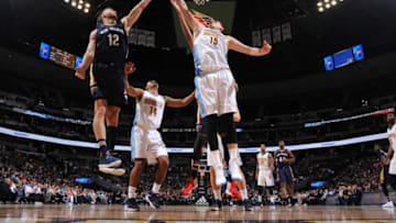 DENVER, CO - APRIL 7: Donatas Motiejunas #12 of the New Orleans Pelicans goes up for a lay up against Nikola Jokic #15 of the Denver Nuggets on April 7, 2017 at the Pepsi Center in Denver, Colorado. NOTE TO USER: User expressly acknowledges and agrees that, by downloading and/or using this Photograph, user is consenting to the terms and conditions of the Getty Images License Agreement. Mandatory Copyright Notice: Copyright 2017 NBAE (Photo by Garrett Ellwood/NBAE via Getty Images)