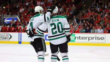 Mar 22, 2016; Chicago, IL, USA; Dallas Stars center Cody Eakin (20) is congratulated for scoring by left wing Patrick Sharp (10) during the third period against the Chicago Blackhawks at the United Center. Dallas won 6-2. Mandatory Credit: Dennis Wierzbicki-USA TODAY Sports
