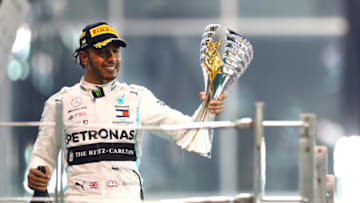ABU DHABI, UNITED ARAB EMIRATES - DECEMBER 01: Race winner Lewis Hamilton of Great Britain and Mercedes GP celebrates on the podium during the F1 Grand Prix of Abu Dhabi at Yas Marina Circuit on December 01, 2019 in Abu Dhabi, United Arab Emirates. (Photo by Mark Thompson/Getty Images)