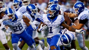 STARKVILLE, MS - OCTOBER 21: Lynn Bowden Jr. #1 of the Kentucky Wildcats tries to find a hole as he carries the ball during the second half of an NCAA football game against the Mississippi State Bulldogs at Davis Wade Stadium on October 21, 2017 in Starkville, Mississippi. (Photo by Butch Dill/Getty Images)