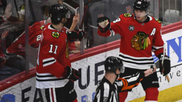 Apr 12, 2022; Chicago, Illinois, USA; Chicago Blackhawks right wing Patrick Kane (88) celebrates his goal with Chicago Blackhawks right wing Taylor Raddysh (11) against the Los Angeles Kings during the third period at the United Center. Mandatory Credit: Matt Marton-USA TODAY Sports