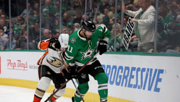 DALLAS, TEXAS - APRIL 29: Luke Glendening #11 of the Dallas Stars battles for the puck against Josh Mahura #76 of the Anaheim Ducks in the first period at American Airlines Center on April 29, 2022 in Dallas, Texas. (Photo by Tom Pennington/Getty Images)
