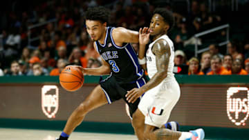MIAMI, FLORIDA - JANUARY 04: Tre Jones #3 of the Duke Blue Devils drives to the basket against Chris Lykes #0 of the Miami Hurricanes during the second half at the Watsco Center on January 04, 2020 in Miami, Florida. (Photo by Michael Reaves/Getty Images)