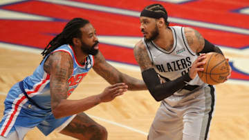 Apr 30, 2021; Brooklyn, New York, USA; Portland Trailblazers power forward Carmelo Anthony (00) controls the ball against Brooklyn Nets center DeAndre Jordan (6) during the fourth quarter at Barclays Center. Mandatory Credit: Brad Penner-USA TODAY Sports