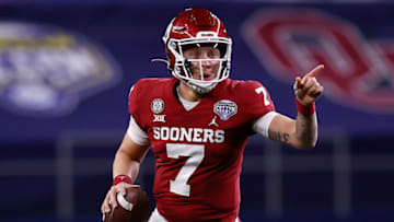ARLINGTON, TEXAS - DECEMBER 30: Quarterback Spencer Rattler #7 of the Oklahoma Sooners scrambles against the Florida Gators during the second quarter at AT&T Stadium on December 30, 2020 in Arlington, Texas. (Photo by Tom Pennington/Getty Images)