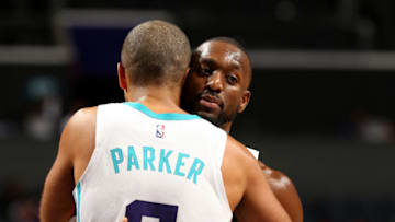 CHARLOTTE, NC - OCTOBER 30: Tony Parker #9 and Kemba Walker #15 of the Charlotte Hornets exchange a hug against the Miami Heat on October 30, 2018 at Spectrum Center in Charlotte, North Carolina. NOTE TO USER: User expressly acknowledges and agrees that, by downloading and or using this photograph, User is consenting to the terms and conditions of the Getty Images License Agreement. Mandatory Copyright Notice: Copyright 2018 NBAE (Photo by Kent Smith/NBAE via Getty Images)