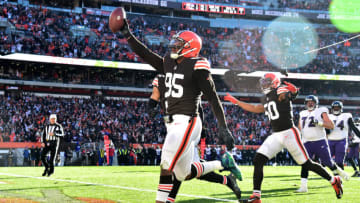 CLEVELAND, OHIO - DECEMBER 12: Myles Garrett #95 of the Cleveland Browns celebrates after running the ball in for a touchdown after a fumble recovery in the second quarter against the Baltimore Ravens at FirstEnergy Stadium on December 12, 2021 in Cleveland, Ohio. (Photo by Jason Miller/Getty Images)